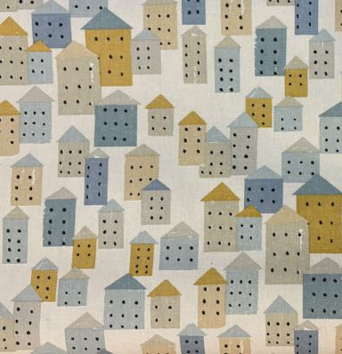 Casas Patrón colorido de casas en diferentes tamaños y tonos de azul, amarillo y beige.
